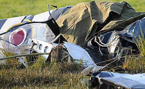 The crumpled cockpit of a crashed replica Spitfire in a cow paddock at Lagoon Pocket on Friday. The crumpled cockpit of a crashed replica Spitfire in a cow paddock at Lagoon Pocket on Friday.